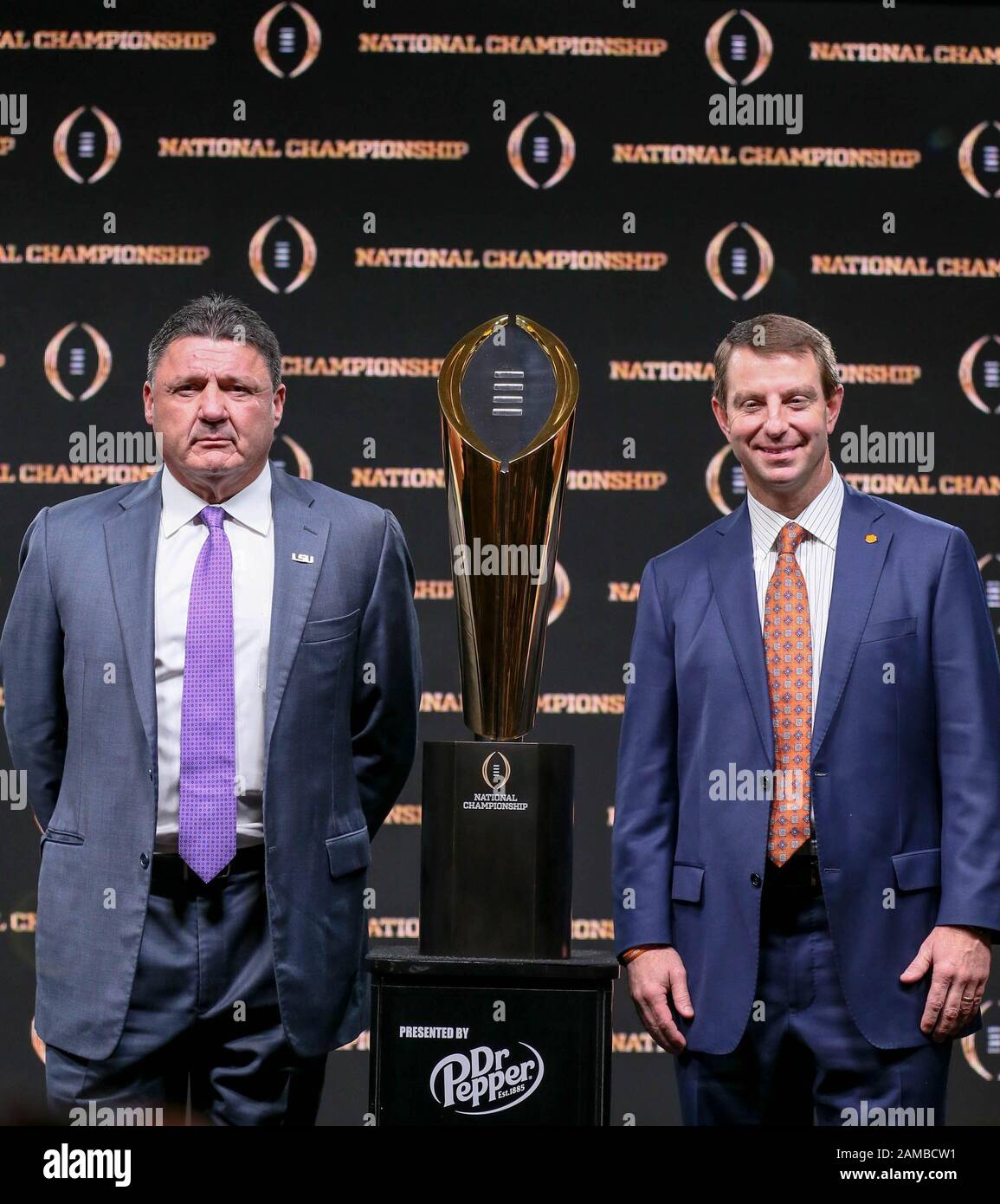 New Orleans, LA, USA. 12th Jan, 2020. LSU Head Coach Ed Orgeron and Clemson Head Coach Dabo Swinney pose with the Championship Trophy after the Head Coaches Press Conference before the College Football National Championship between the Clemson Tigers and the LSU Tigers at the Sheraton Hotel in New Orleans, LA. Jonathan Mailhes/CSM/Alamy Live News Stock Photo