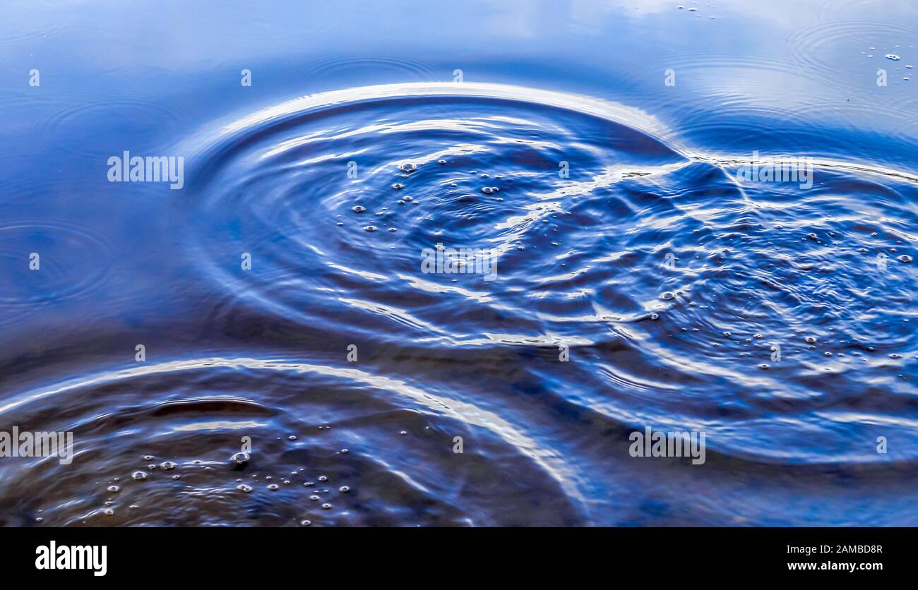 Beautiful water waves and ripples from a drop falling into a water ...