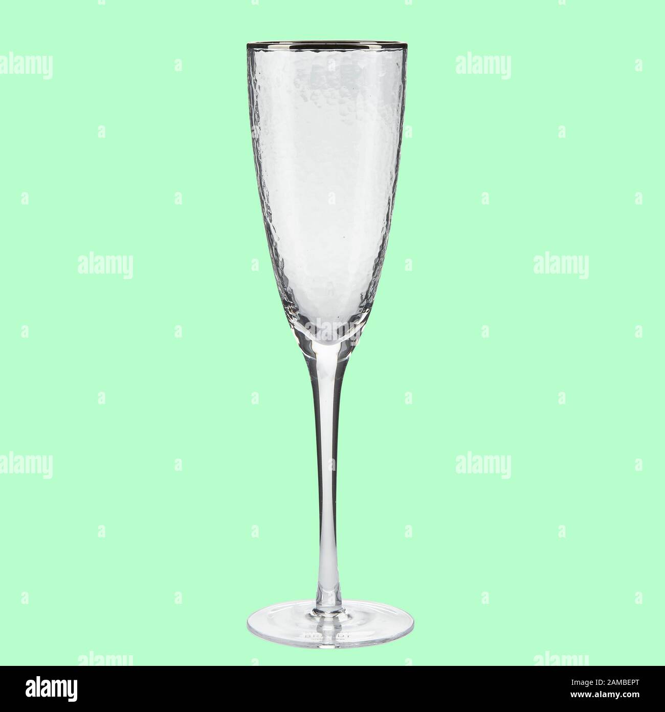 Empty wing glass on green background single with clipping path Stock Photo
