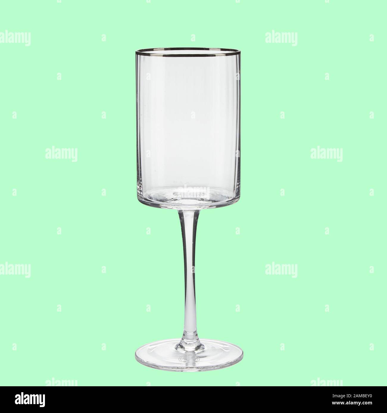 Empty wing glass on green background single with clipping path Stock Photo