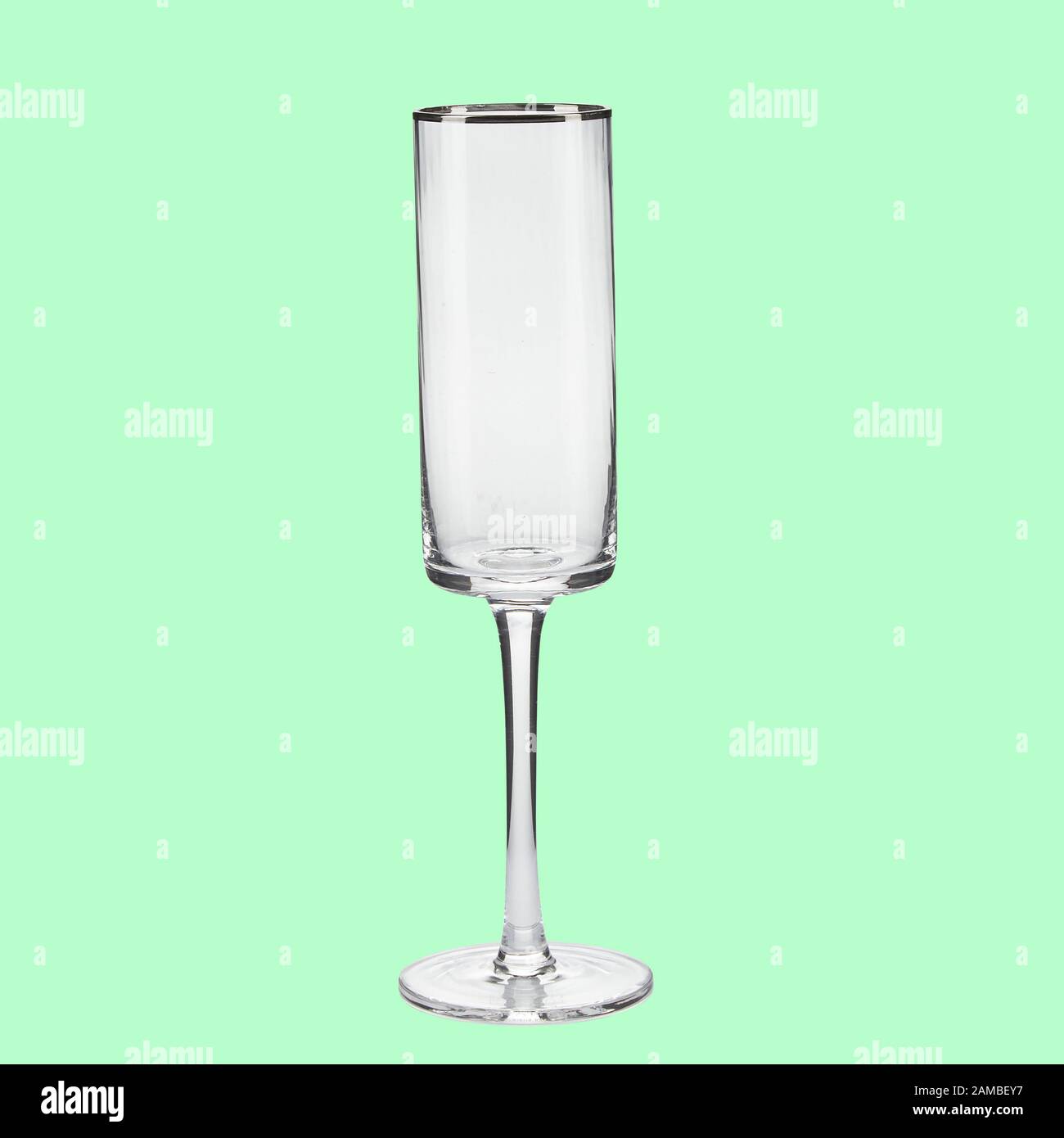 Empty wing glass on green background single with clipping path Stock Photo