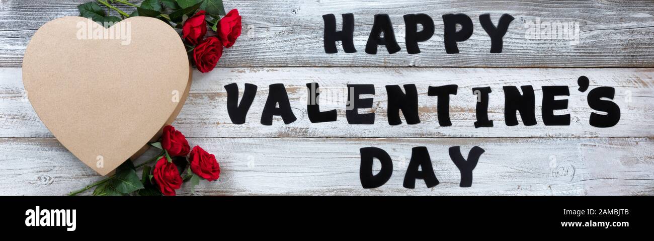 Happy Valentines Day with large gift box in shape of heart and red ...