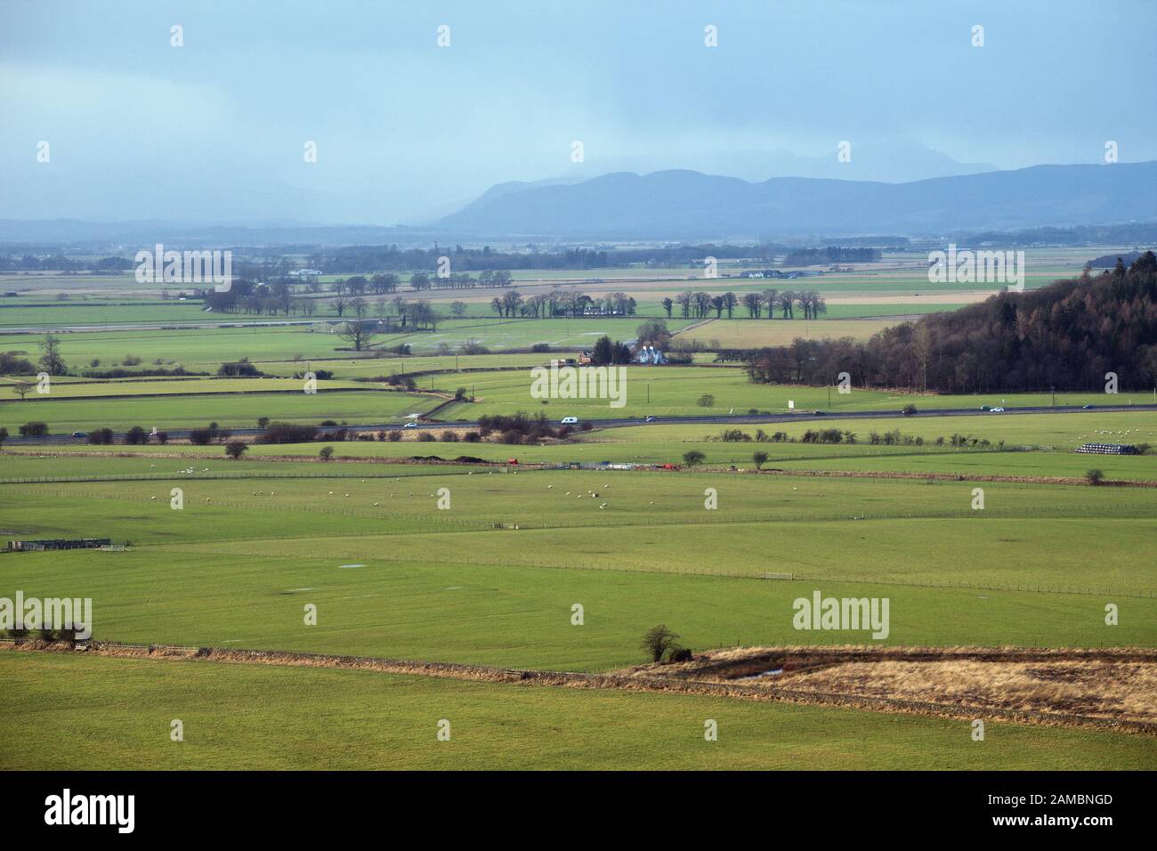 Scottish winter landscape with green fields and mountains. Stirling, Scotland Stock Photo