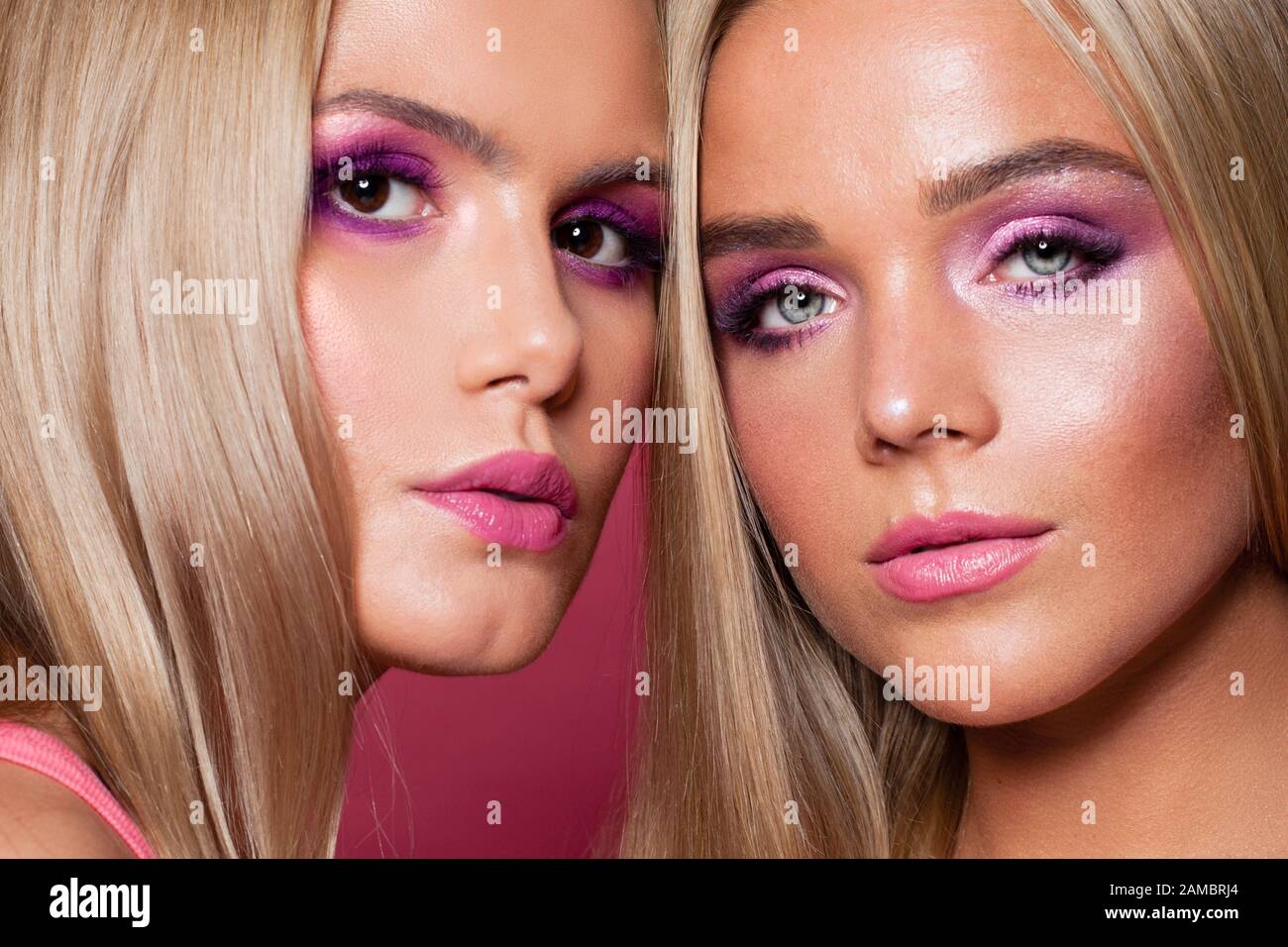 Two beautiful female faces close up portrait Stock Photo