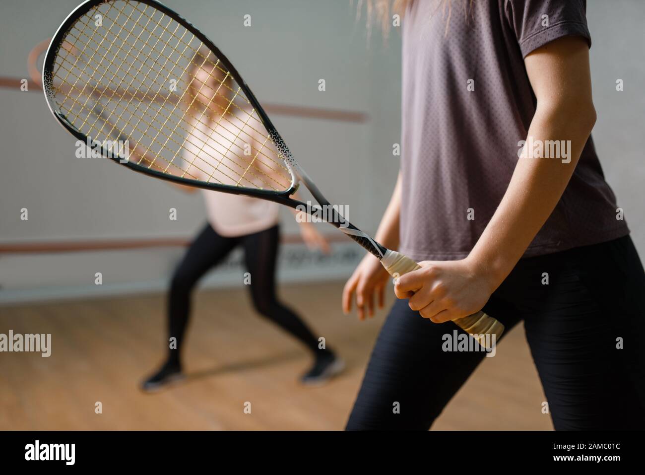 Two female players with rackets, squash game Stock Photo Alamy