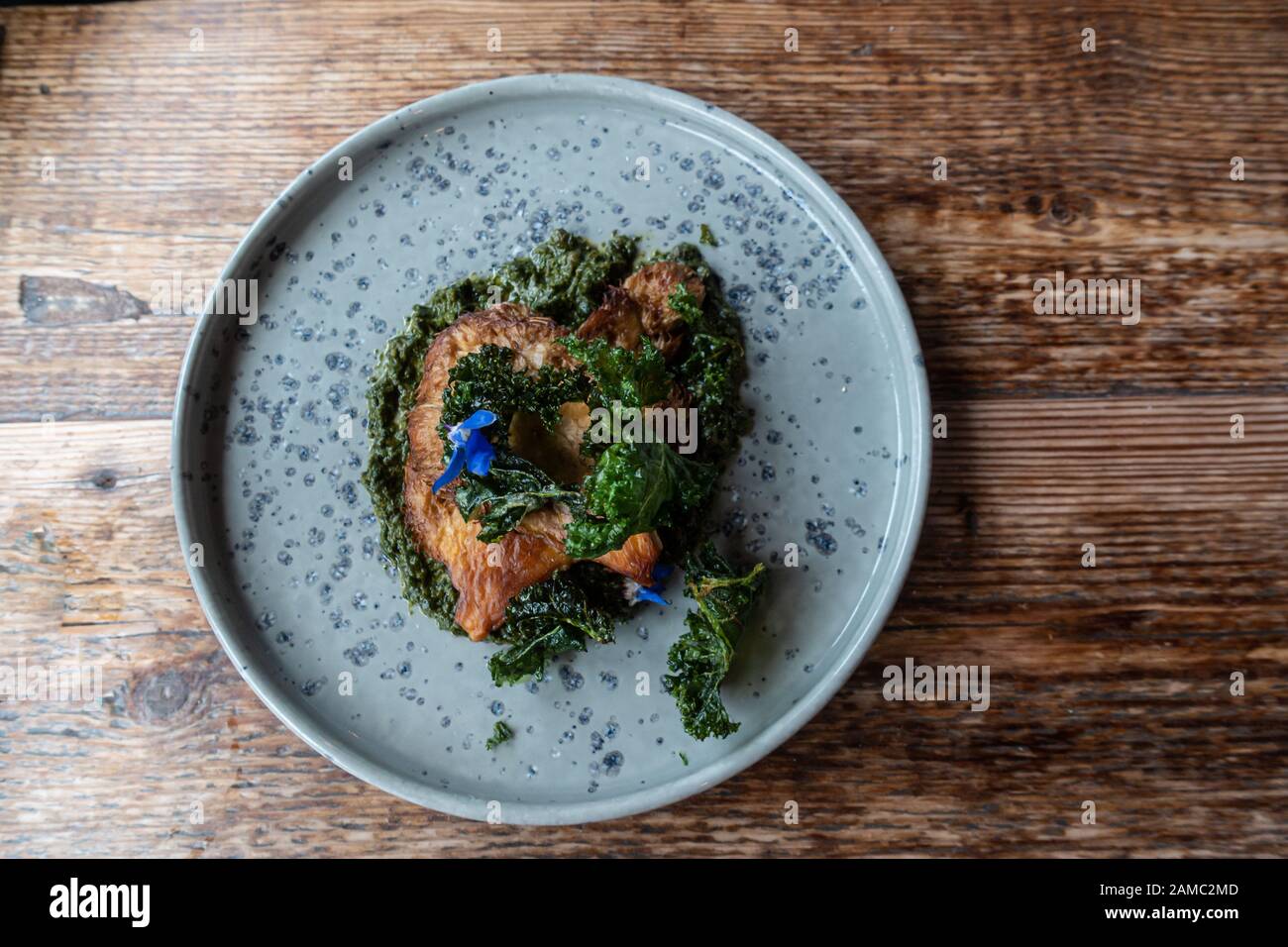 Seared lions mane mushrooms, salsa verde meal at The Ethicurian restaurant, UK Stock Photo