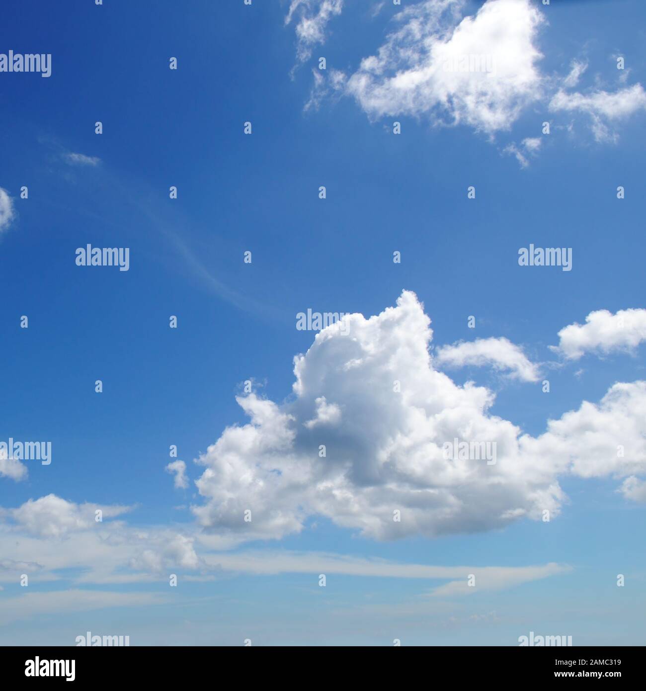 light cumulus clouds in the blue sky Stock Photo - Alamy