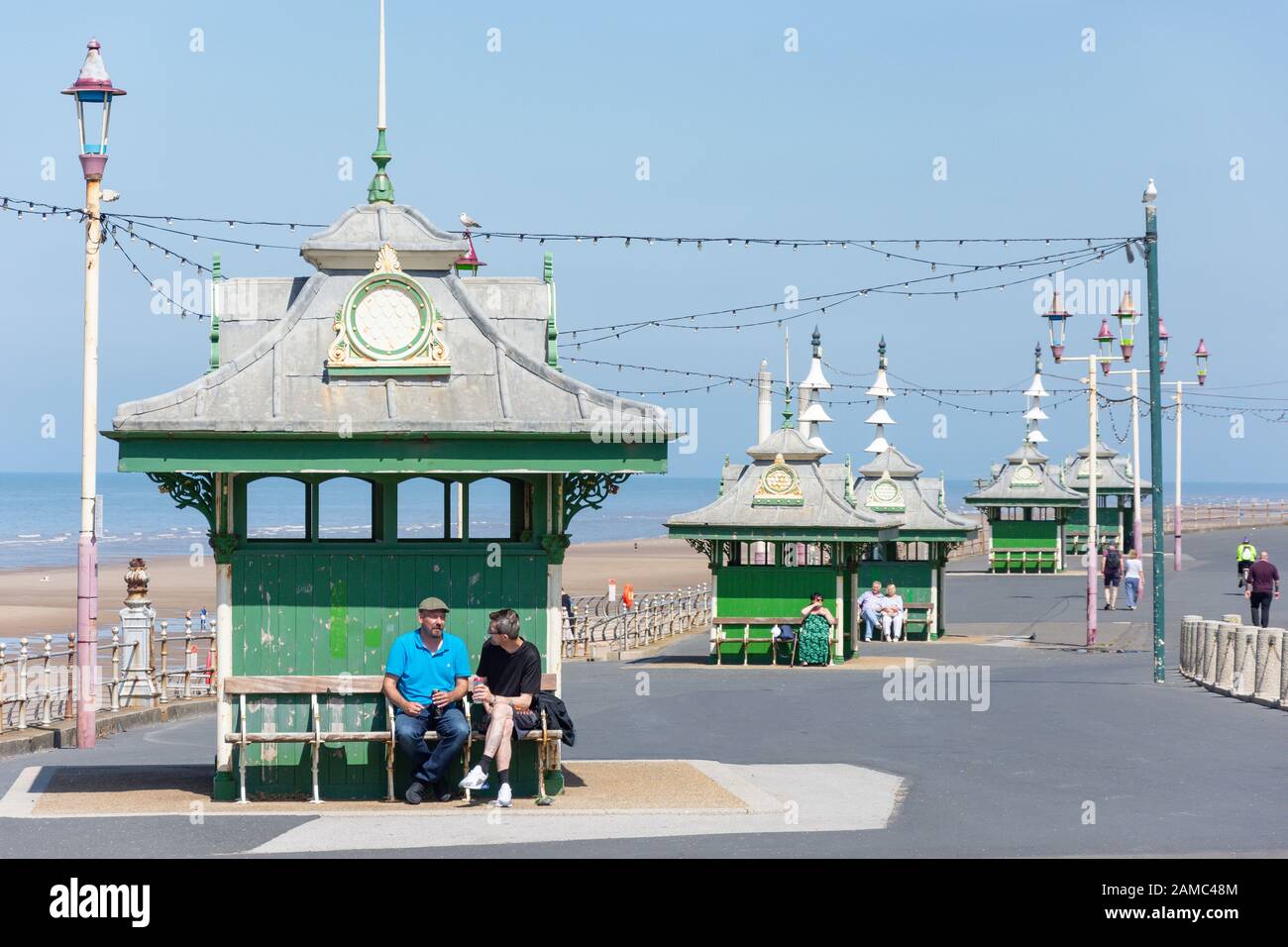 Vintage beach shelter huts on beach promenade blackpool victoria hires stock photography and