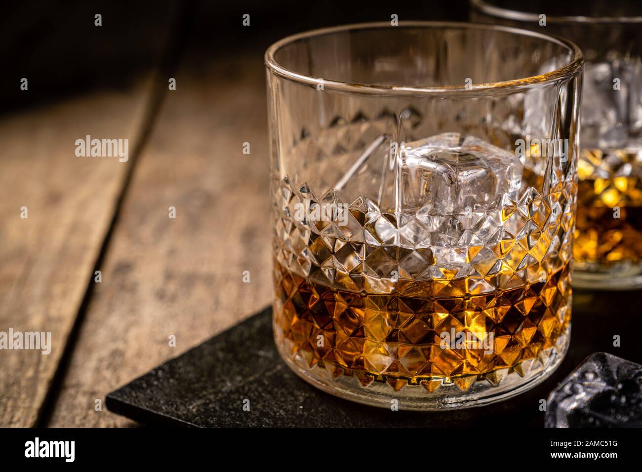 Whiskey in glasses on wood background Stock Photo