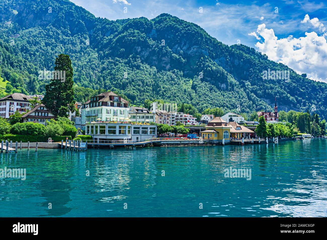 The pier at Vitznau on the Lake Lucerne in Switzerland with Hotel Terrasse am See left Stock Photo