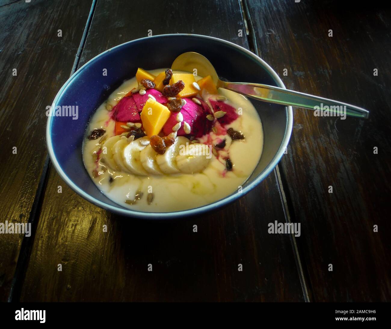 Bowl of fresh exotic fruits, with yogurt Stock Photo Alamy