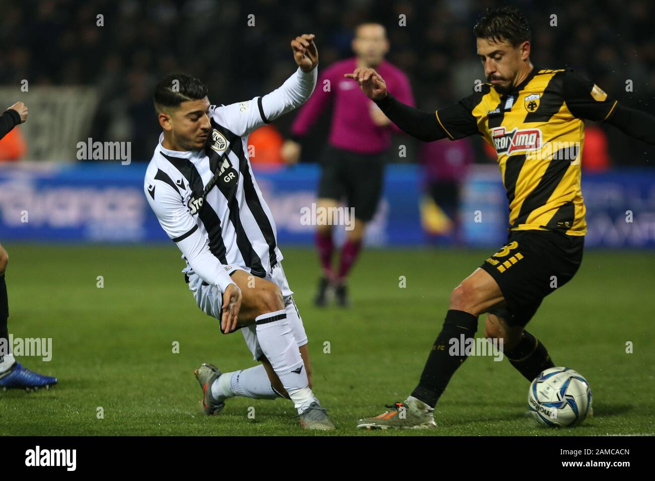 Thessaloniki, Greece. 12th Jan, 2020. PAOK FC player Dimitris Limnios (L)  and AEK's Nelson Oliveira (R) fight for the ball. Classic derby for the  Greek Soccer Superleague between PAOK FC and AEK
