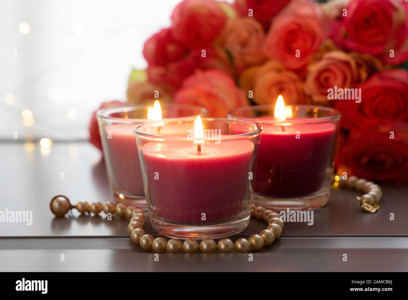 Burning Candles With Rose Fresh Flowers Bouquet On Gray Table Close Up Home Interior Details Stock Photo Alamy