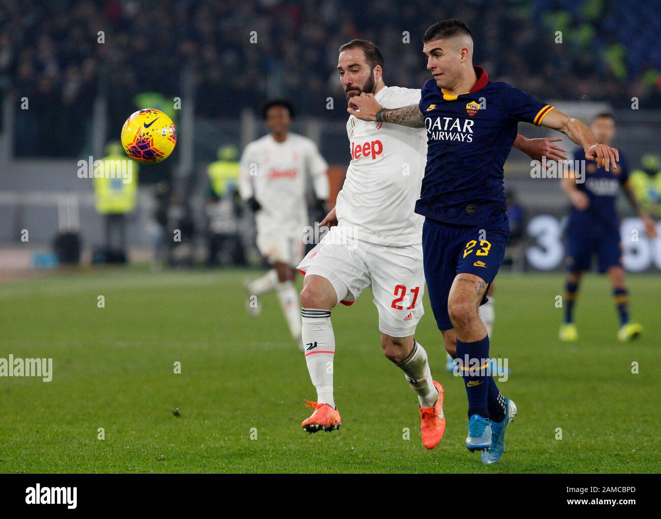 Rome, Italy, 12th January, 2020. Juventus' Gonzalo Higuain, right, is challenged by Roma s Gianluca Mancini during the Serie A soccer match between Roma and Juventus at the Olympic Stadium. Juventus won 2-1. Credit Riccardo De Luca - UPDATE IMAGES / Alamy Live News Stock Photo