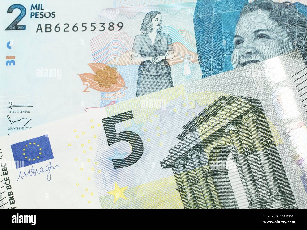 A blue and green, European five euro bank note with a blue two thousand peso  note from Colombia close up in macro Stock Photo - Alamy