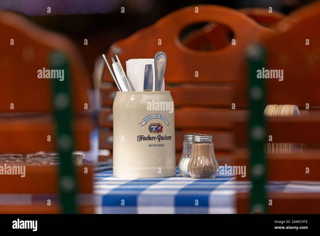 Beer Mug of Hacker Pschorr Brewery on a beergarden table in Munich Stock Photo