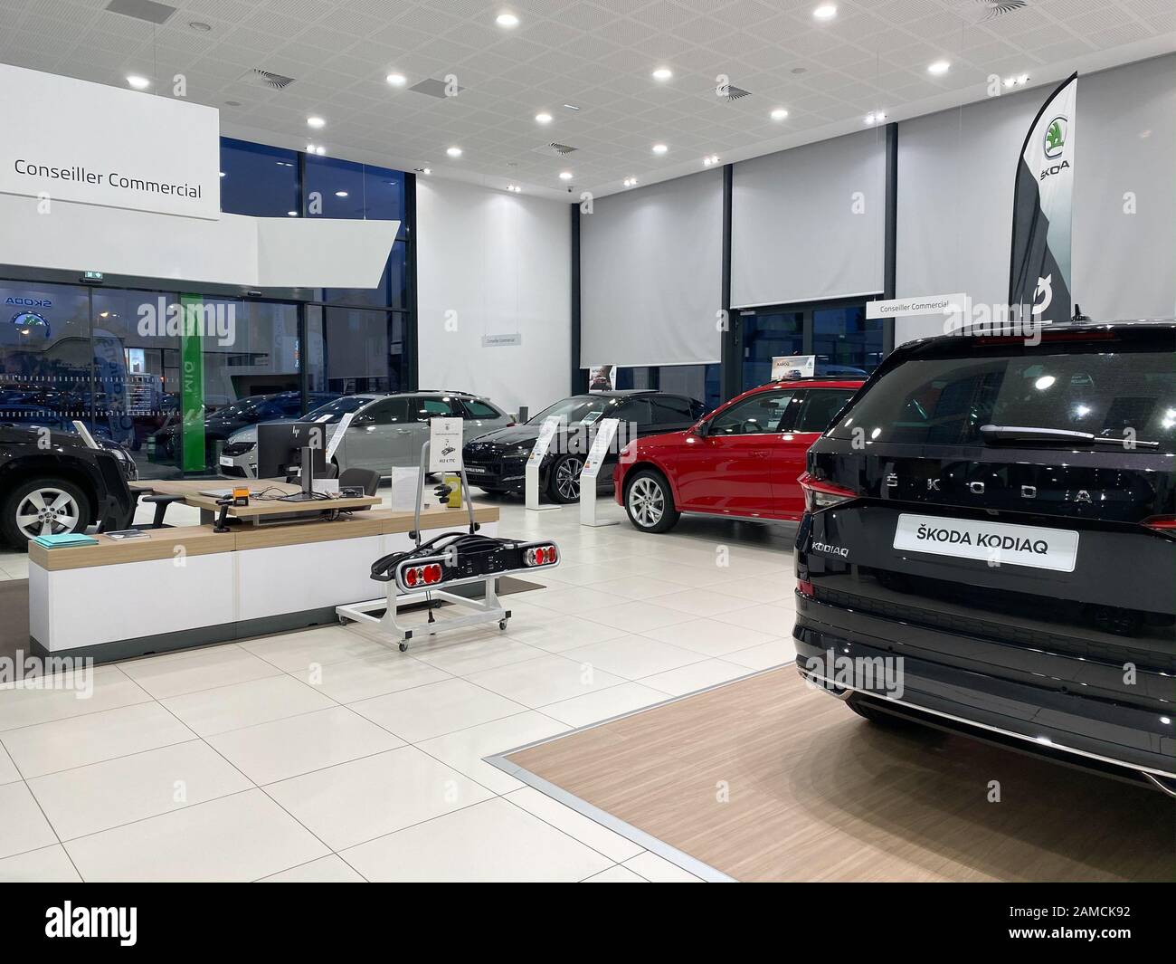 Paris, France - Oct 25, 2019: Wide angle view of car dealership showroom interior with multiple Skoda Cars inside Stock Photo