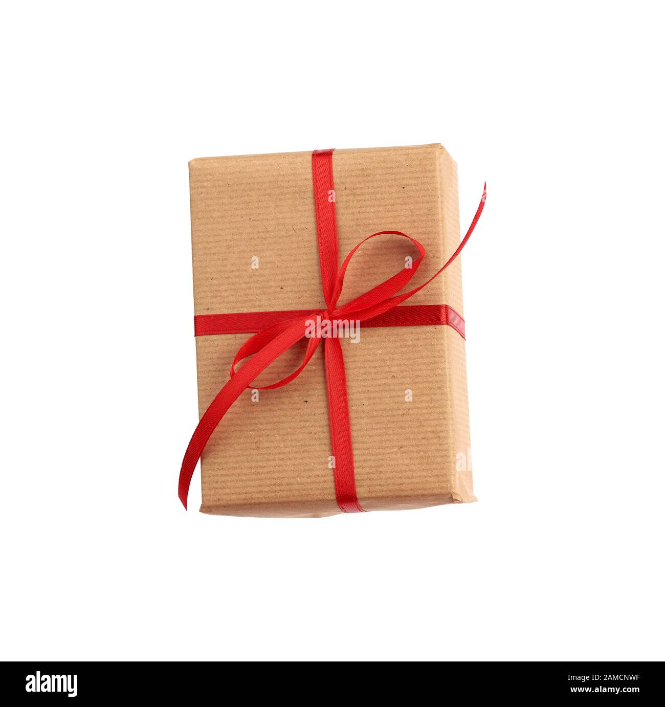 rectangular box wrapped in brown paper and tied with a red bow, gift ...