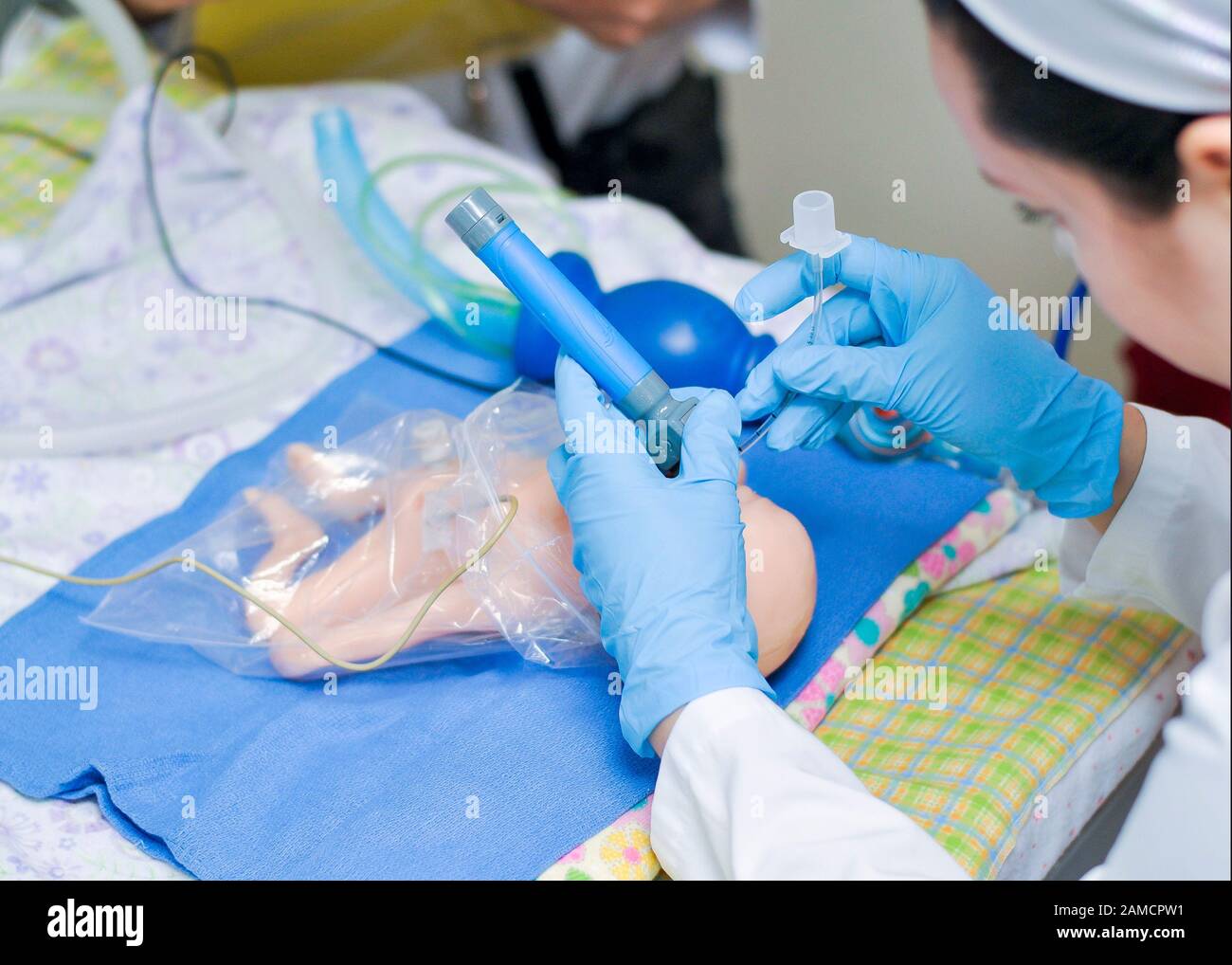 Intubating a baby doll simulator.  Children Hospital. Guayaquil.  Ecuador Stock Photo