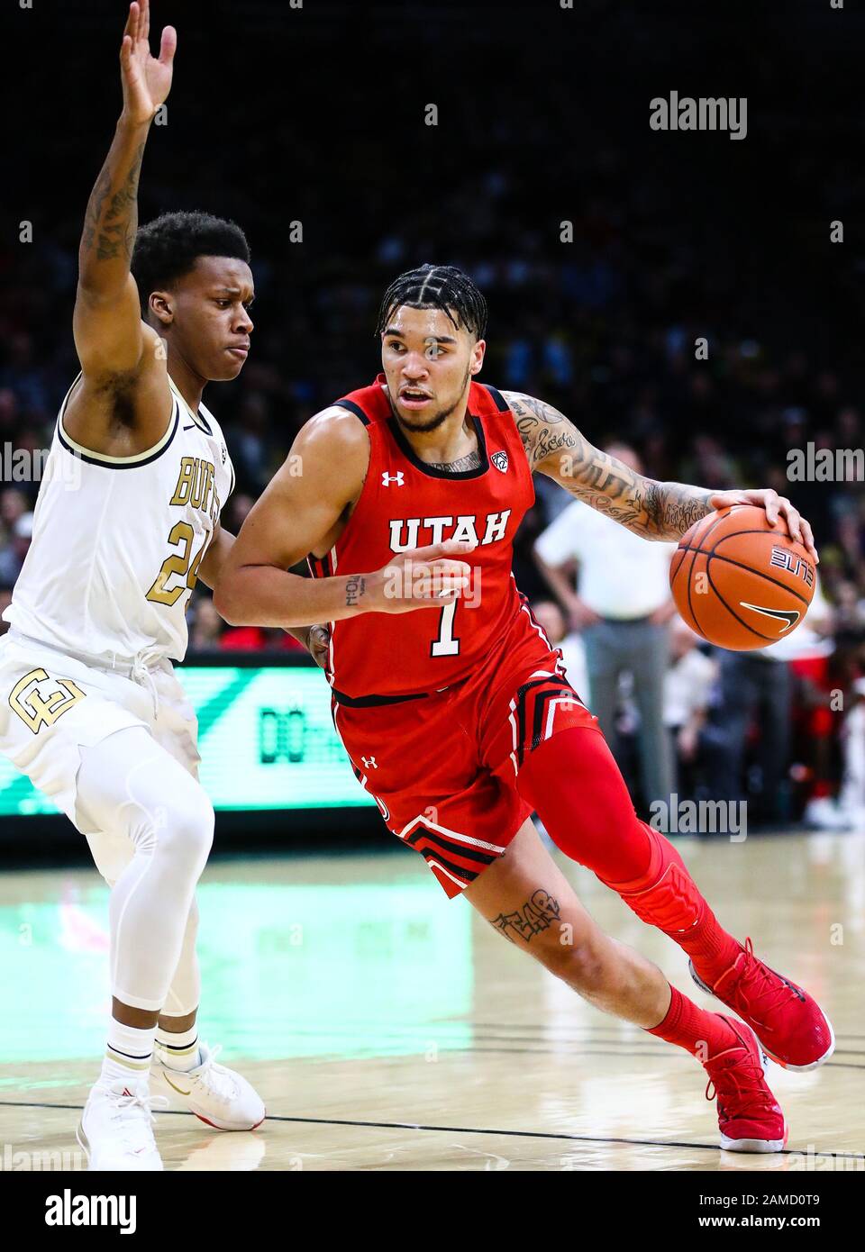 January 12, 2020: Utah Utes forward Timmy Allen (1) drives against Colorado Buffaloes guard Eli Parquet (24) in the men's basketball game between Colorado and Utah at the Coors Events Center in Boulder, CO. Colorado raced out to a 26-7 lead in the first half. Derek Regensburger/CSM. Stock Photo