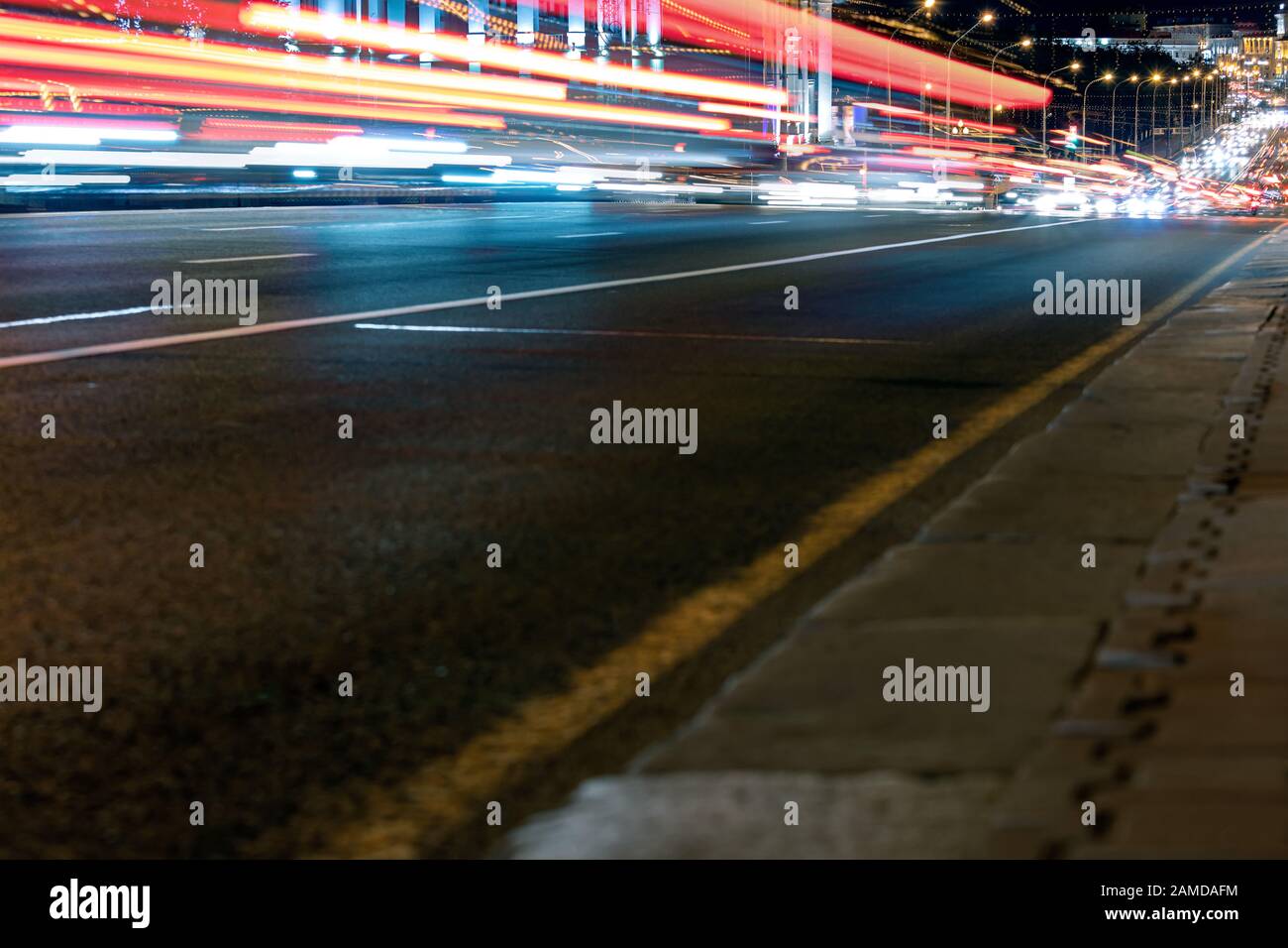 colorful bright light trails from cars in motion. long exposure effect Stock Photo