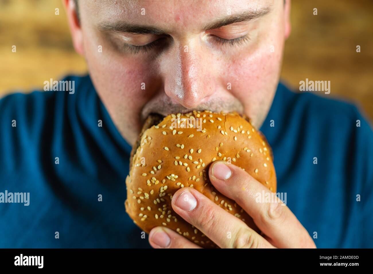 Man Enjoying Burger Stock Photo