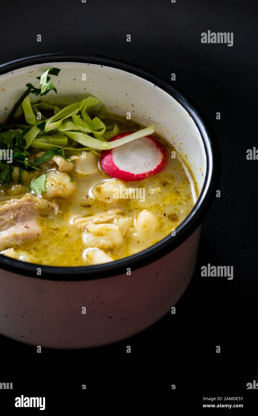 Pozole verde, or green posole is traditionally made with hominy and ...