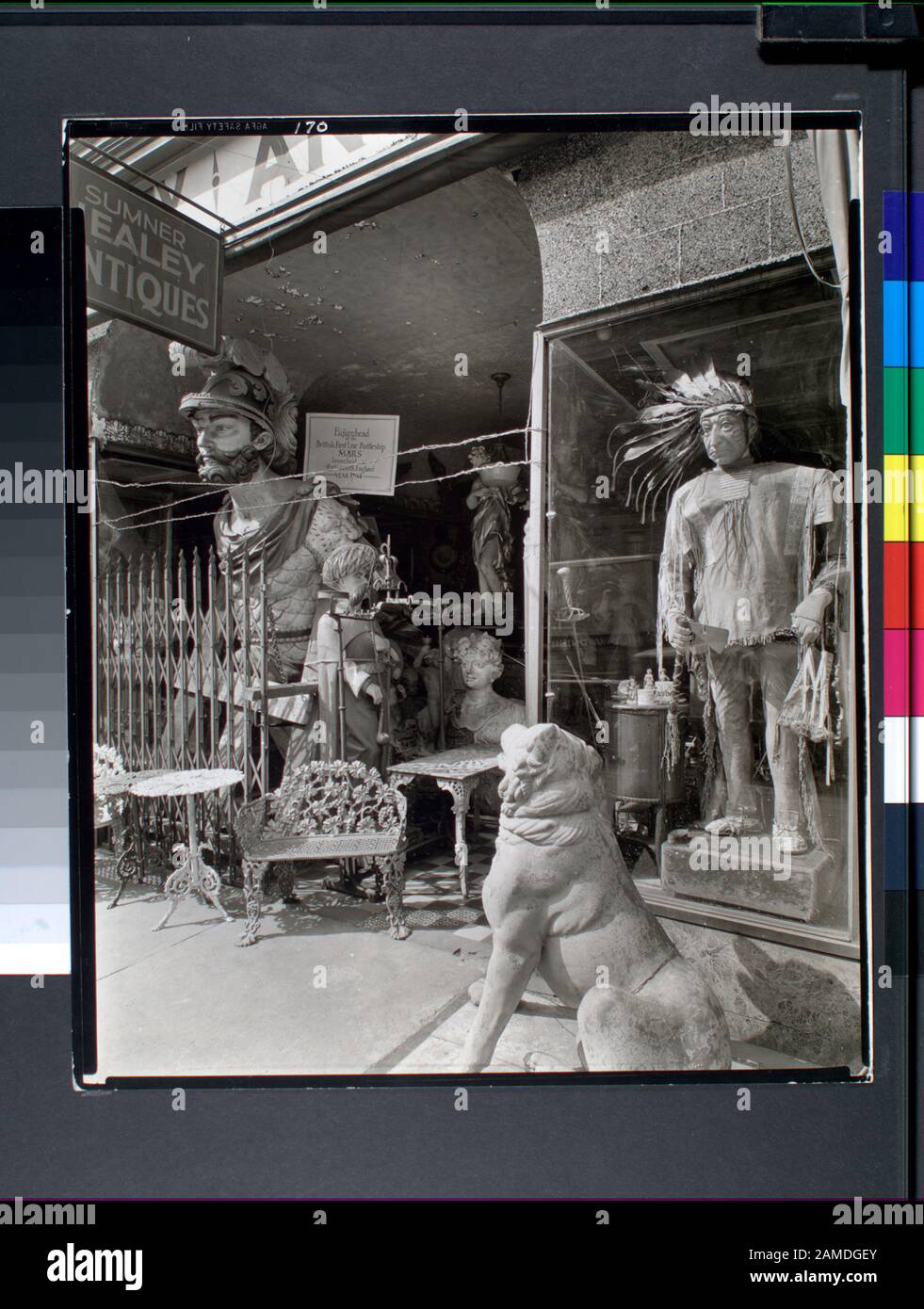 Sumner Healey Antique Shop 942 Third Avenue And 57th Street Manhattan Code I A 5 Wooden Indian In Buckskins Figurehead From The British Battleship Mars Lawn Furniture Stone Dog Etc In The Door With