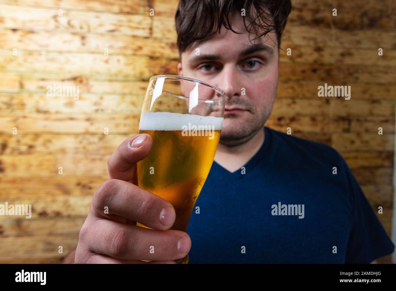 Men drinking beer. Portrait of handsome young men drinking beer. Stock Photo