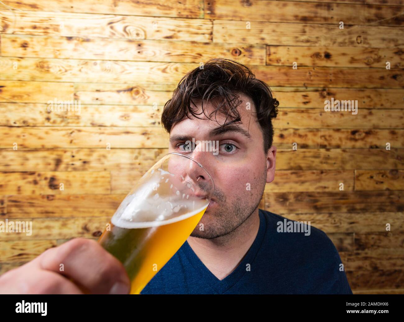 Men drinking beer. Portrait of handsome young men drinking beer. Stock Photo