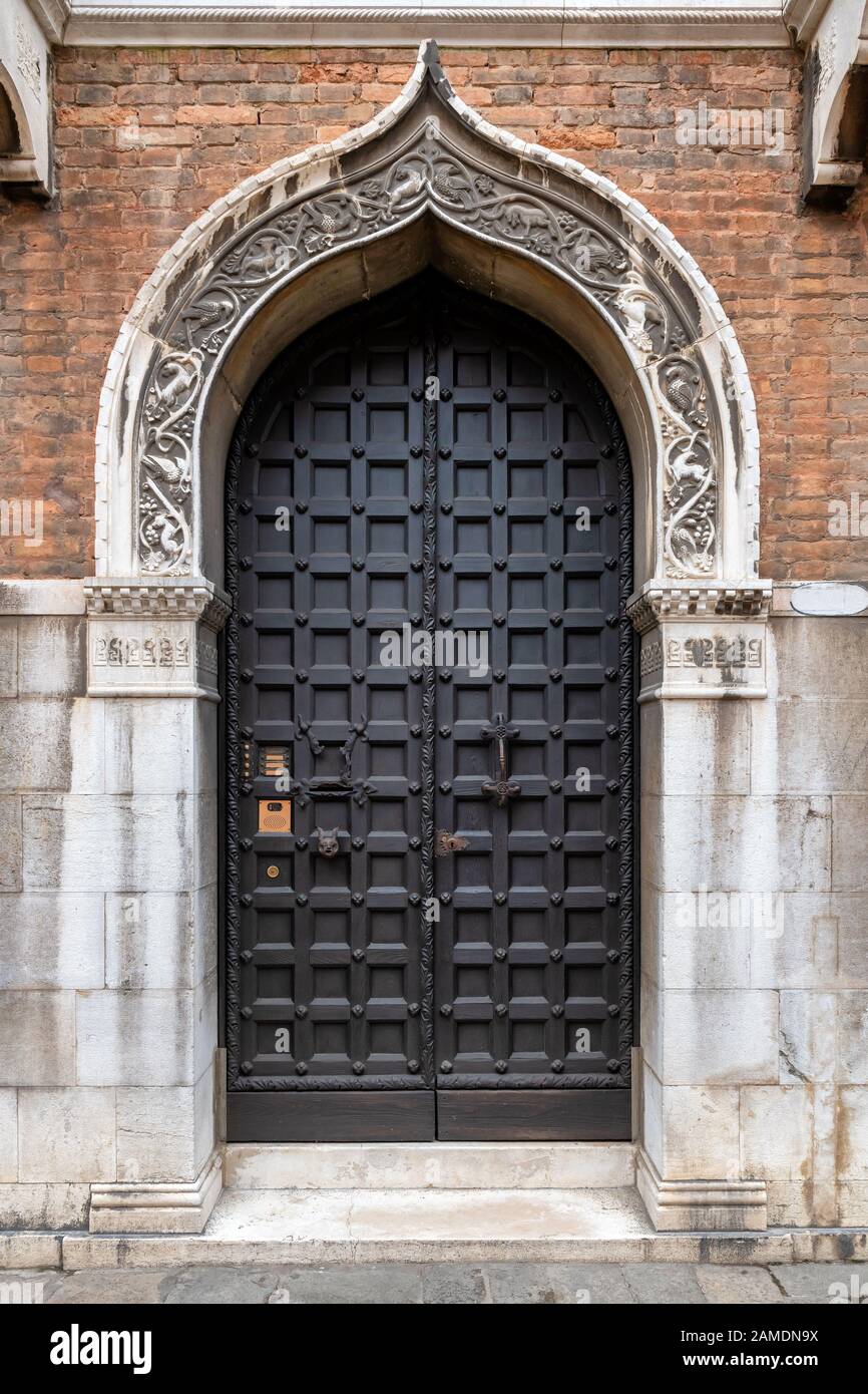 Old traditional door in Venice, Italy Stock Photo