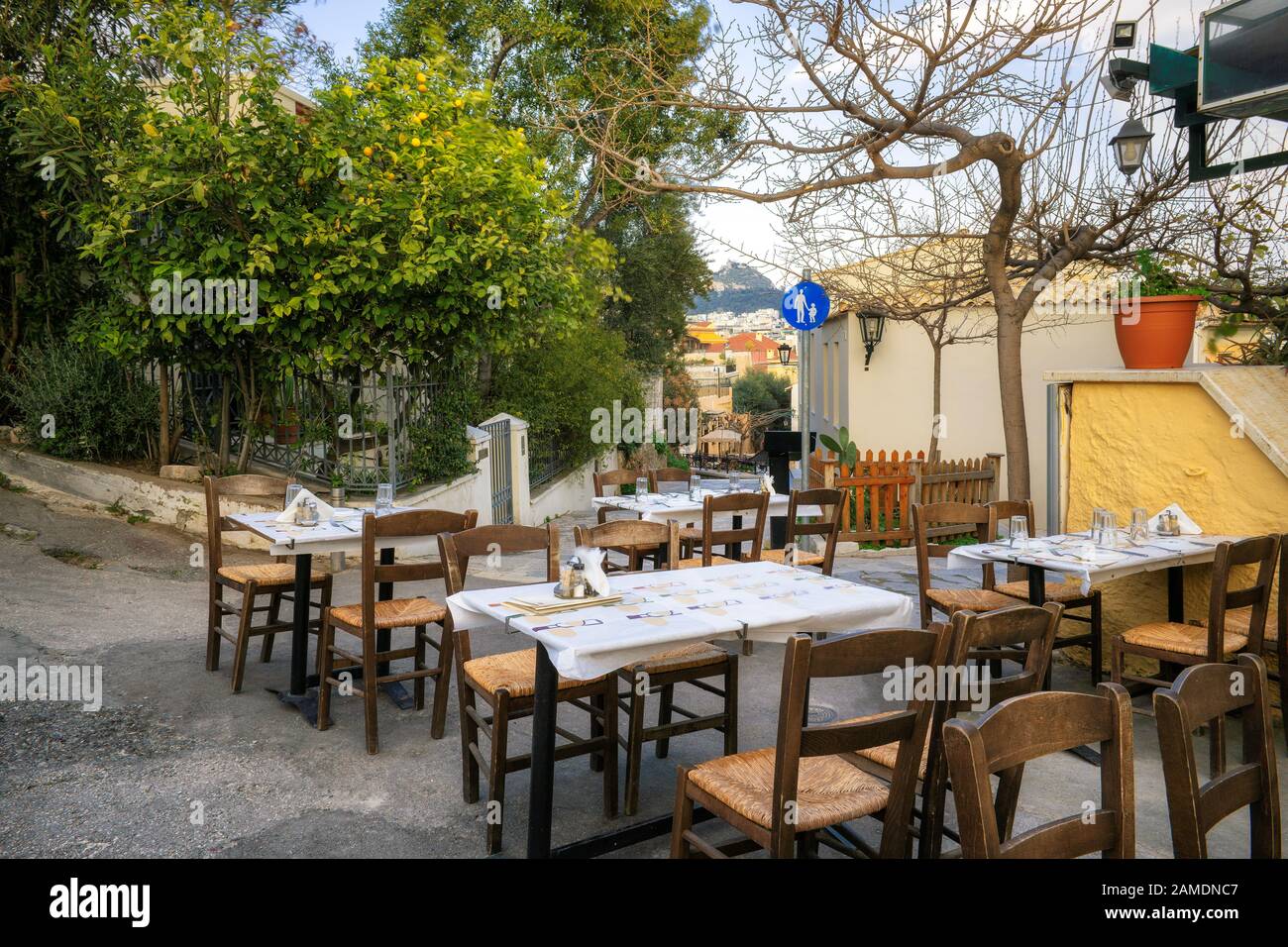 Cafe in old cozy street in Plaka district, Athens, Greece Stock Photo