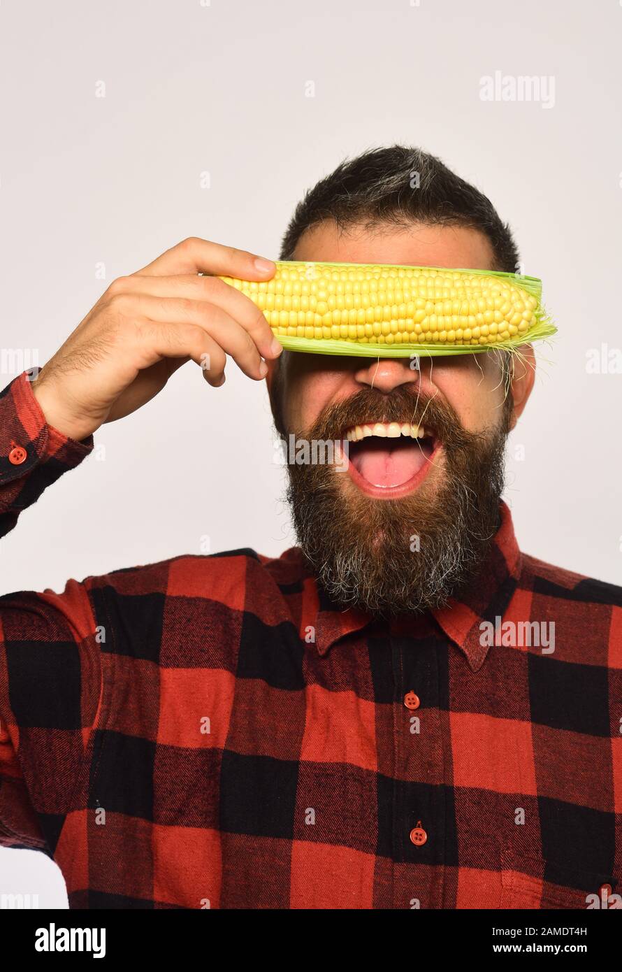 Farming and autumn crops concept. Farmer with hidden cheerful face with