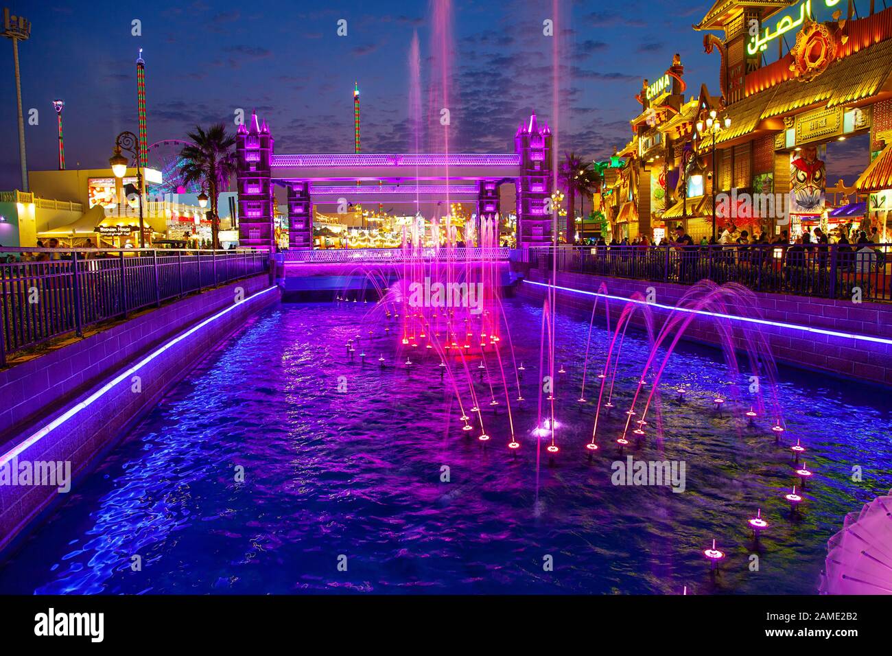 Dubai Global Village Night Lights and water view Stock Photo