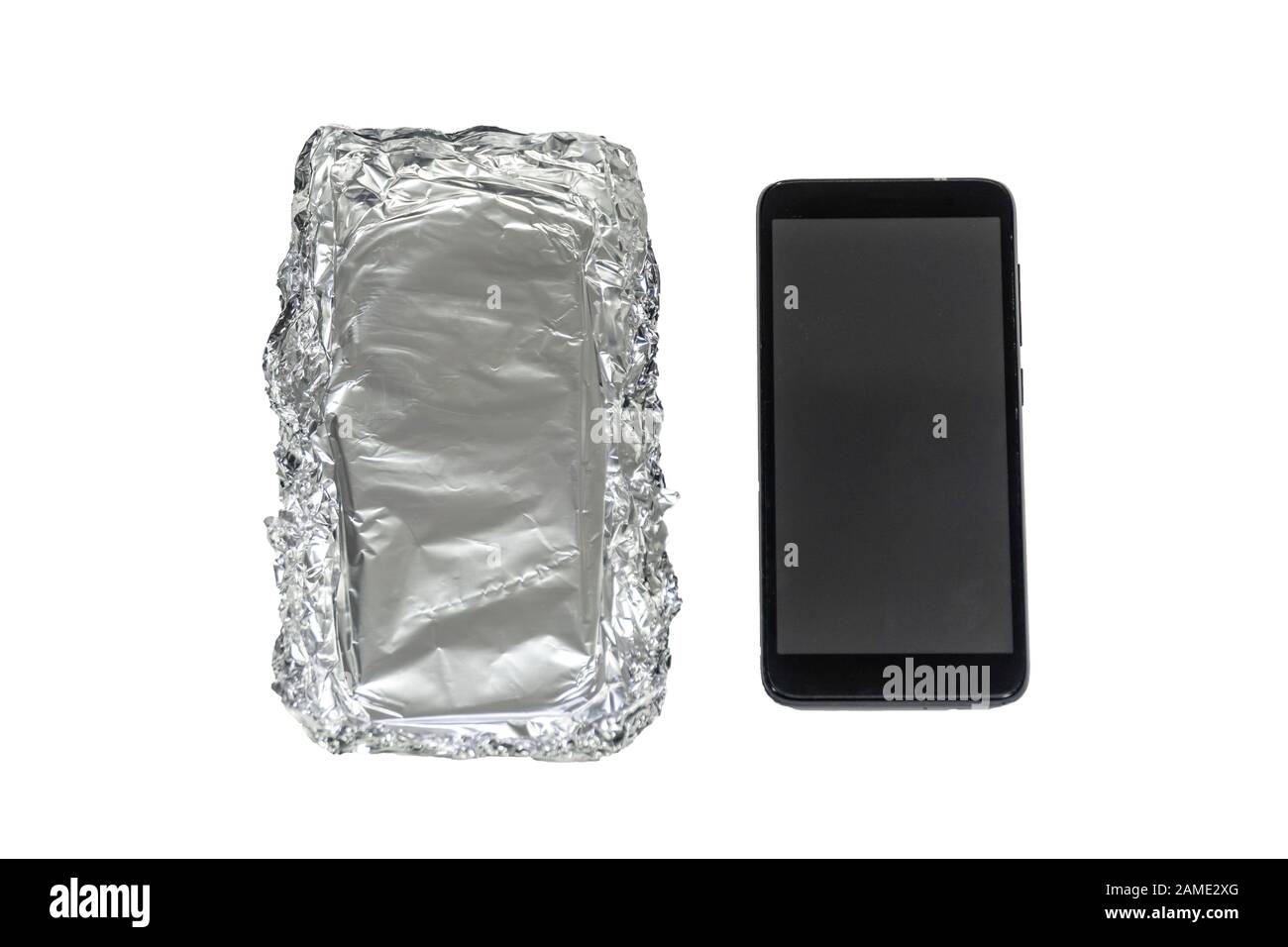 Smartphone and protection case made out of aluminum foil isolated on