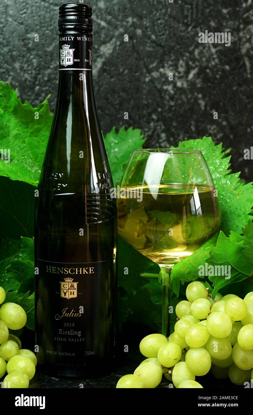 Wine bottle and glass of Australian Barossa Valley premium export wine, Henschke Julius 2018 Eden Valley Reisling, illustrative editorial, vertical. A Stock Photo