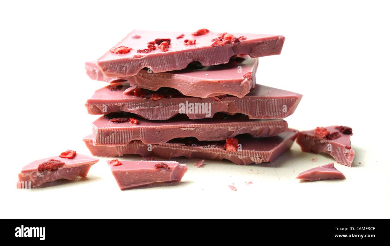 Ruby chocolate stack, made botanical cocoa bean varieties that have the right attributes to be processed into ruby chocolate, from the macro close up Stock Photo