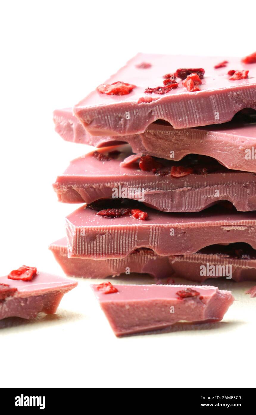Ruby chocolate stack, made botanical cocoa bean varieties that have the right attributes to be processed into ruby chocolate, from the macro close up Stock Photo