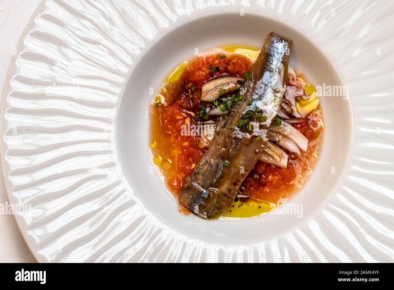 A plate of marinated sardines at seafood restaurant Stock Photo