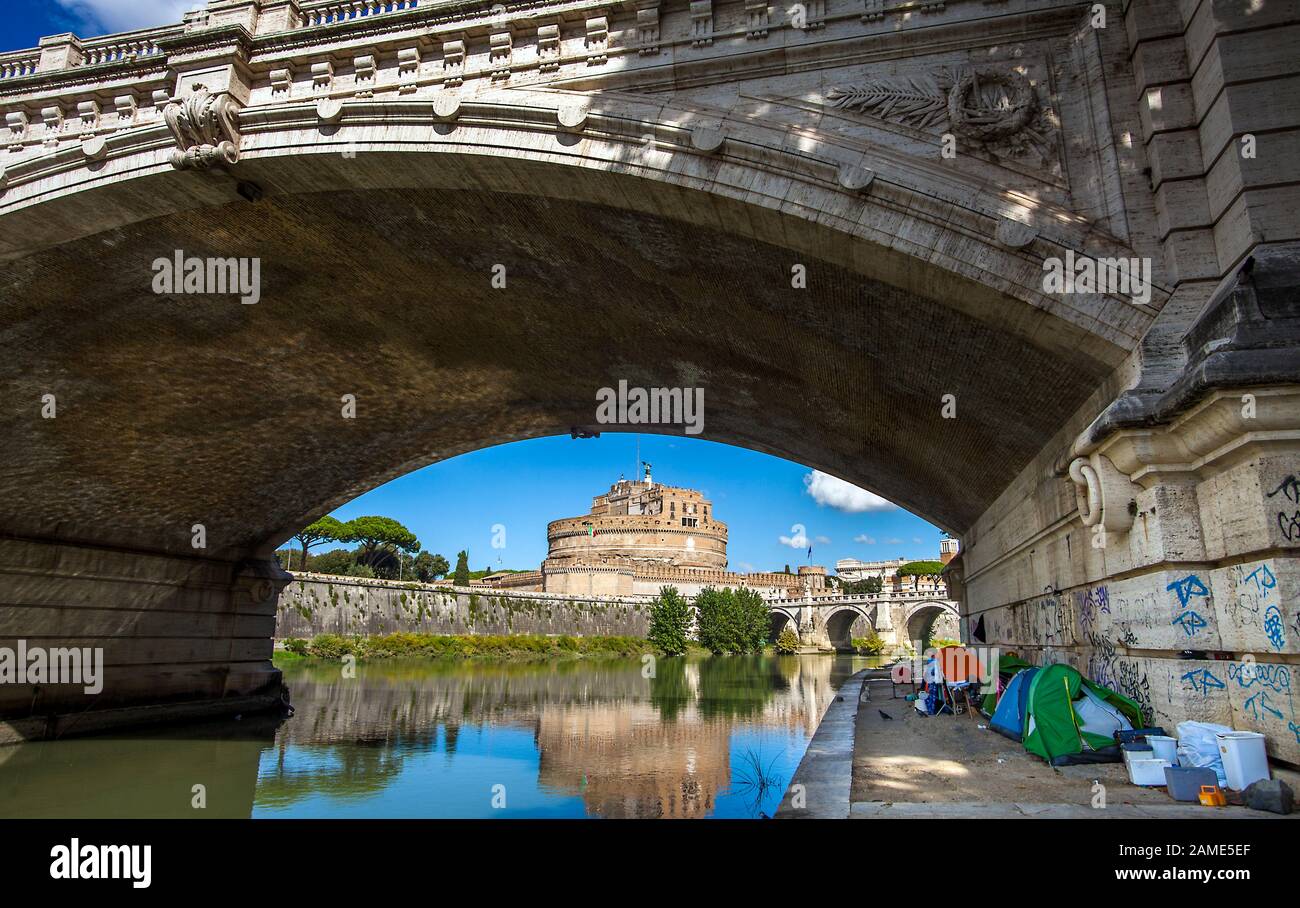 Rome Italy on October 6th, 2019 Tents of homeless people under the Ponte Vittorio Emanuele II bridge Stock Photo