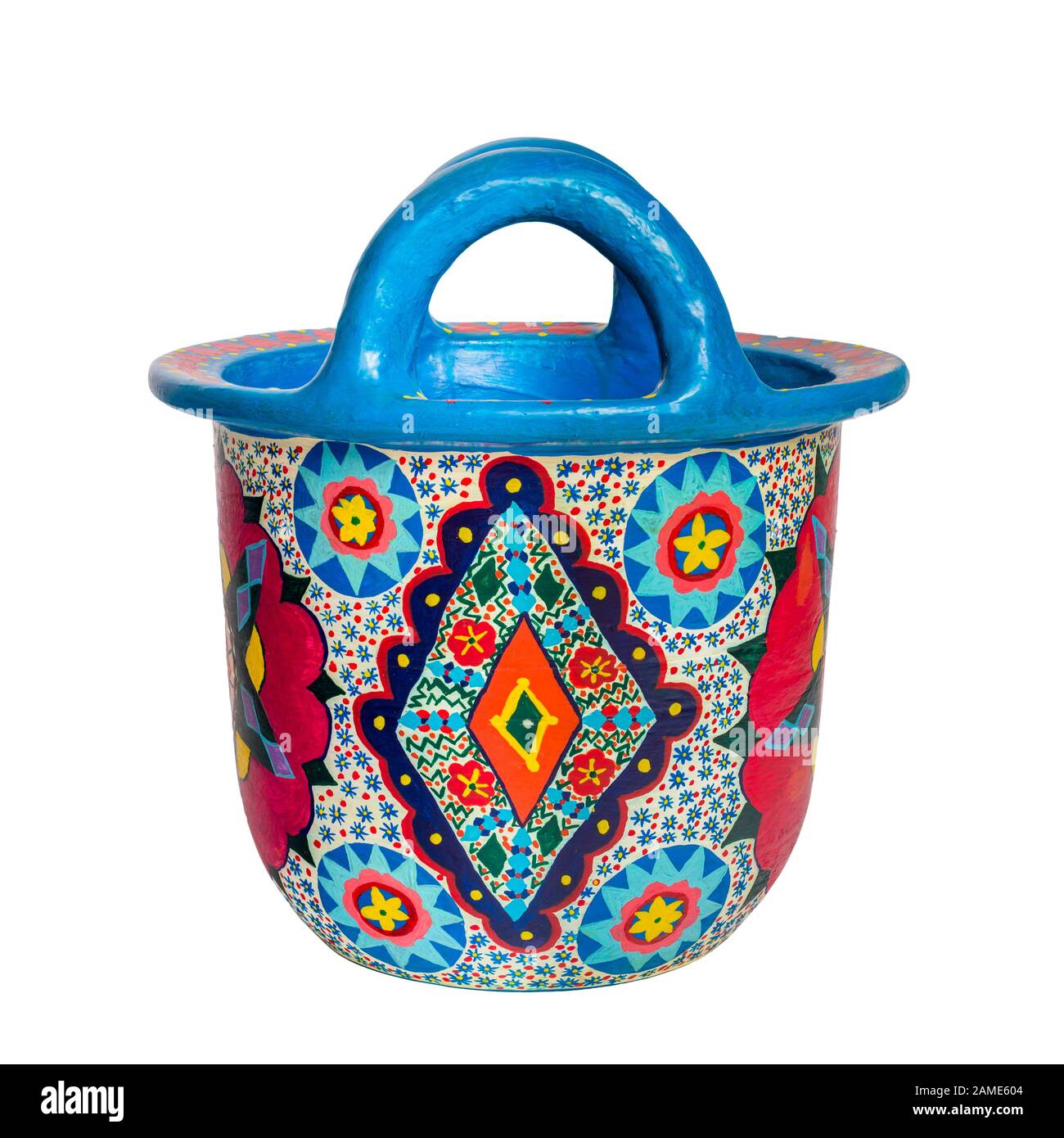 Cut out of handmade artistic pained colorful decorated pottery basket with two handles isolated