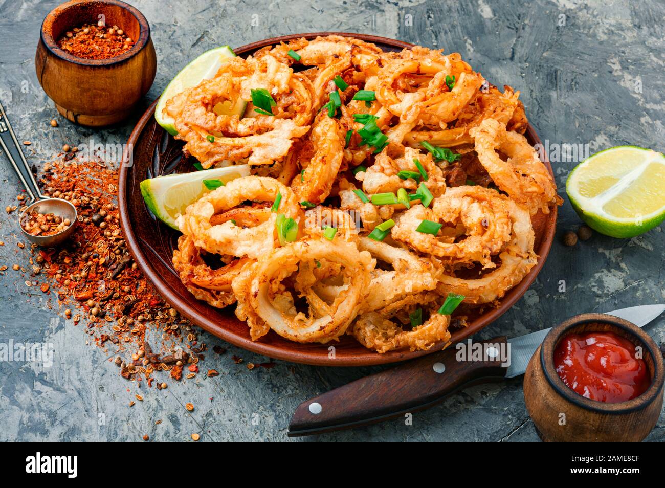 Fried squid or calamari rings with sauce Stock Photo Alamy