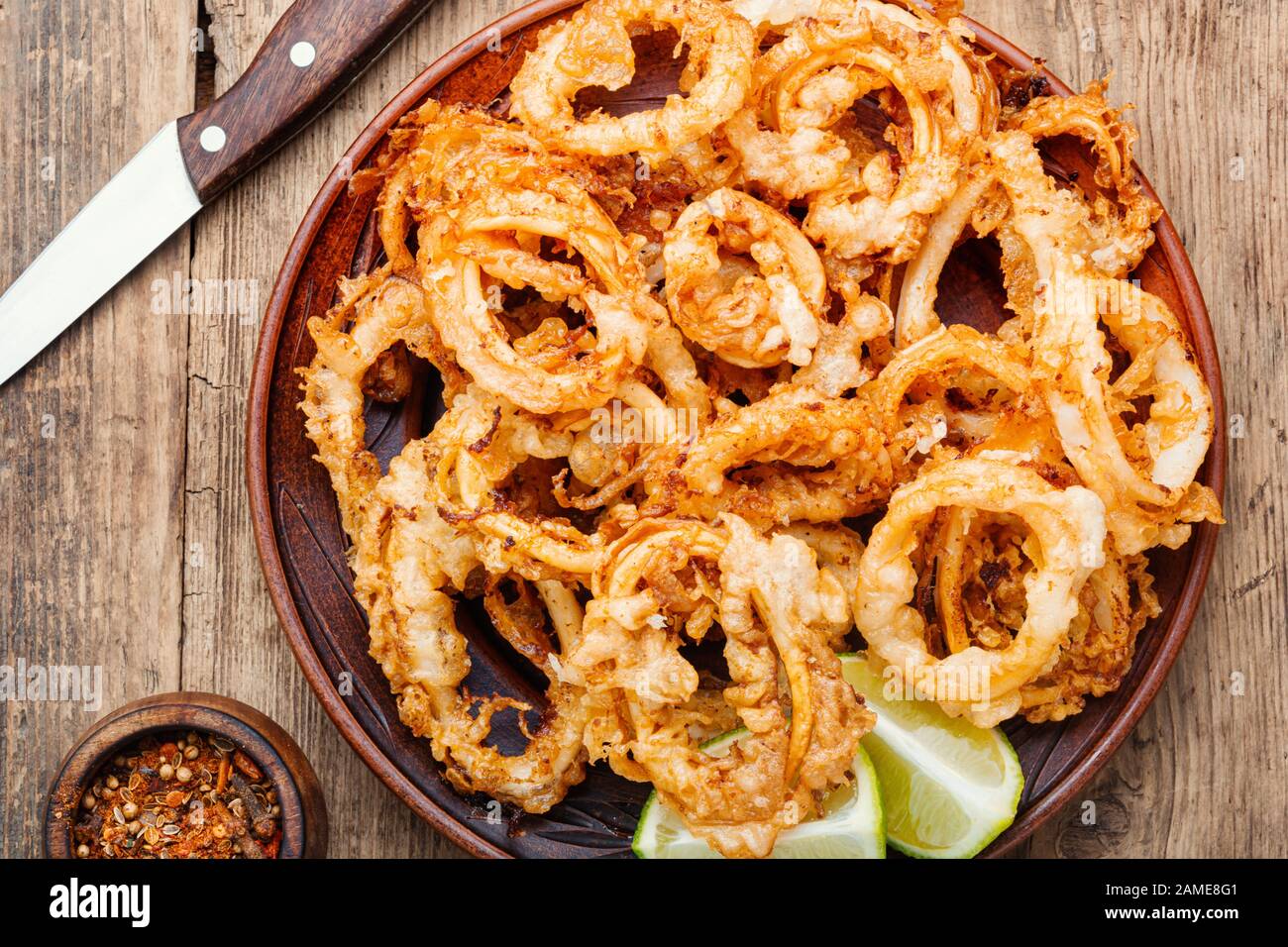 Crunchy deep fried squid rings in batter Stock Photo - Alamy