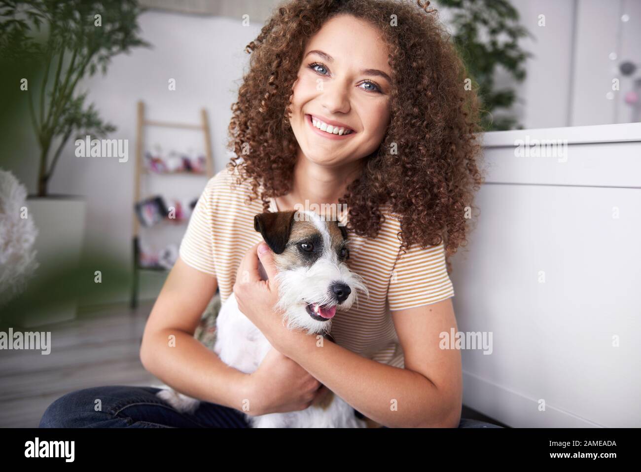 Portrait of smiling teenage girl with her dog Stock Photo - Alamy