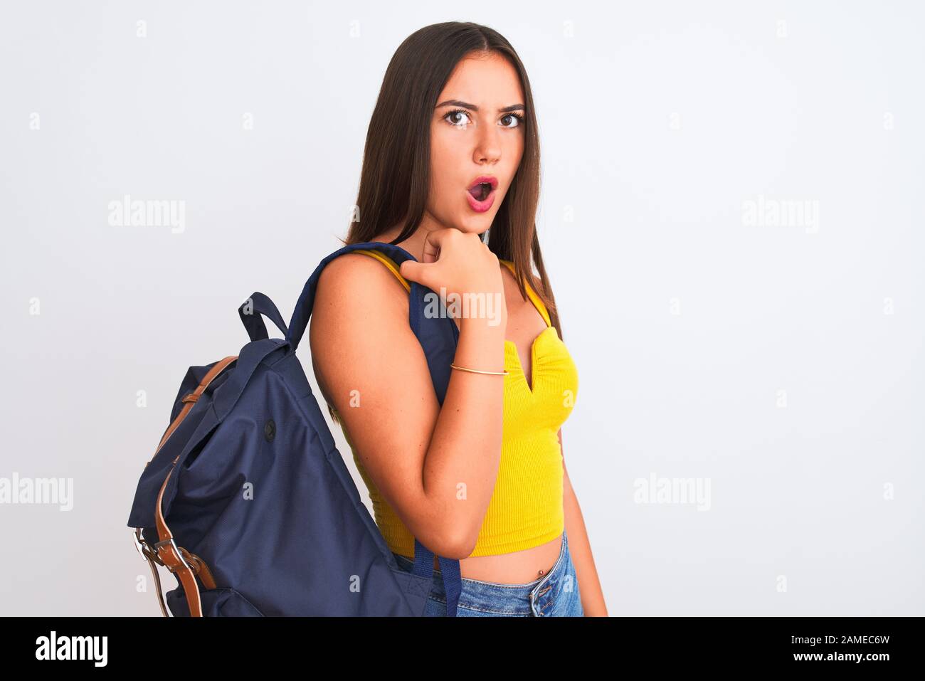 Young beautiful student girl wearing backpack standing over isolated ...