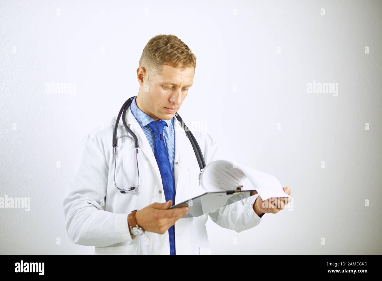 Young confident doctor in a white coat with a stethoscope Stock Photo ...