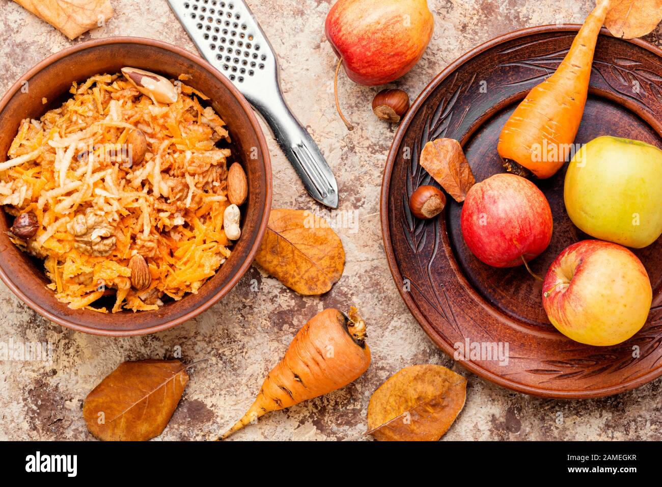 Seasonal autumn salad, grated apples with carrots. Stock Photo