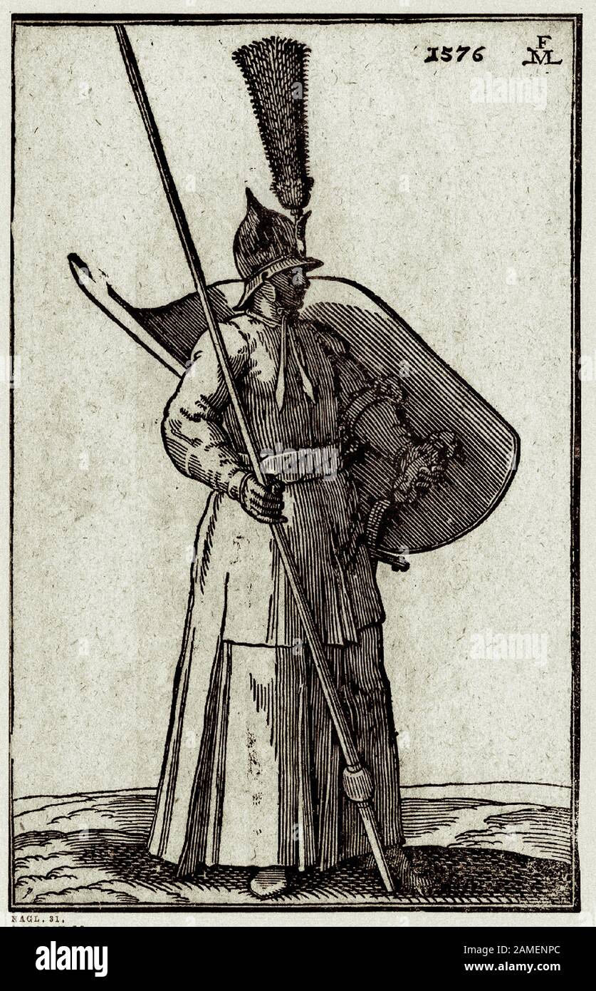 The history of Ottoman Empire. A foot soldier; a tuft of feathers attached to his helmet; the lance in his right hand resting on ground; a large curve Stock Photo