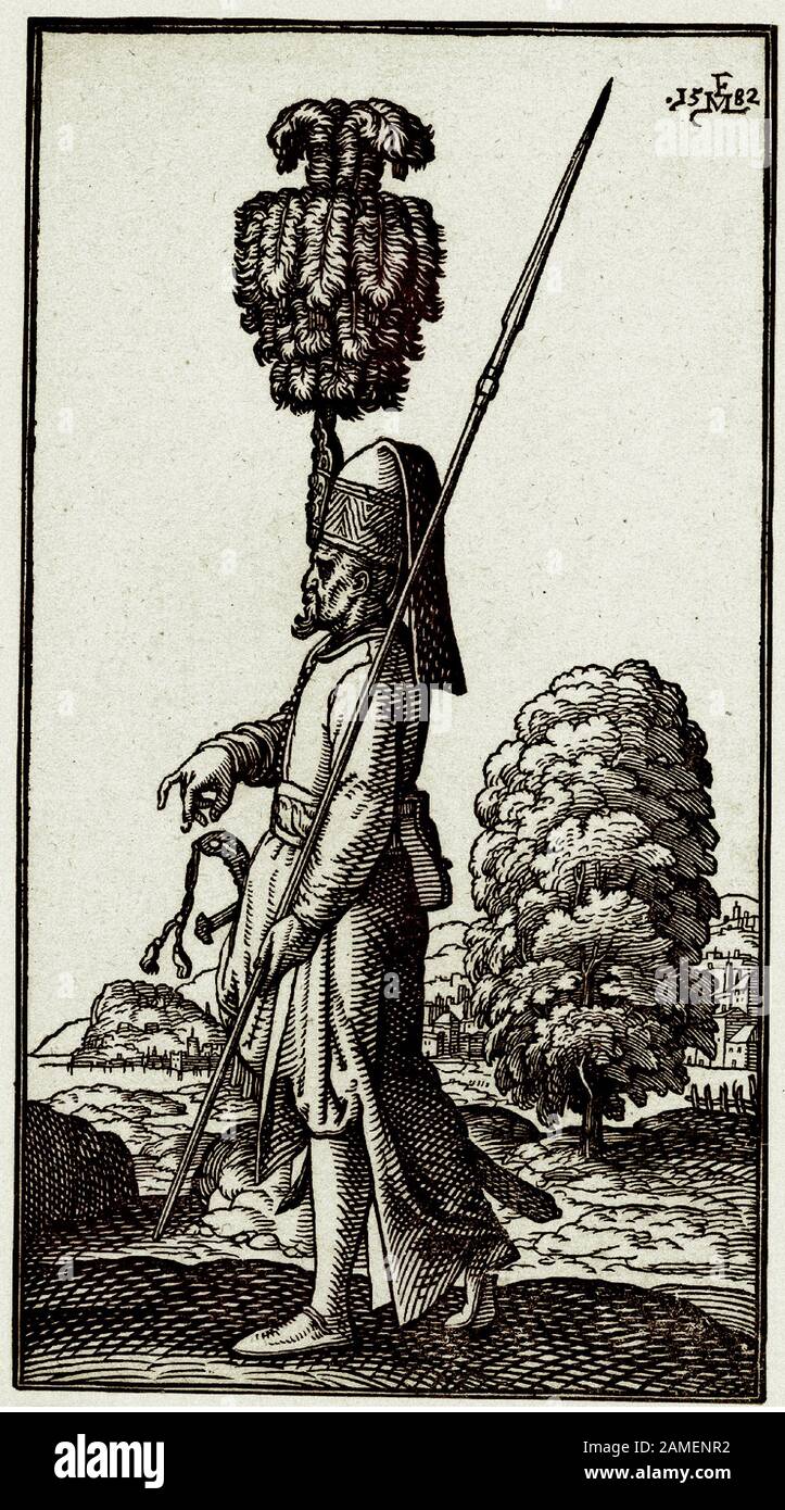 A Janissary (Yeniceri); wearing the kece with a very long feather; holding a lance; an axe tucked into his belt. By Melchior Lorck. 1570-1583 Stock Photo