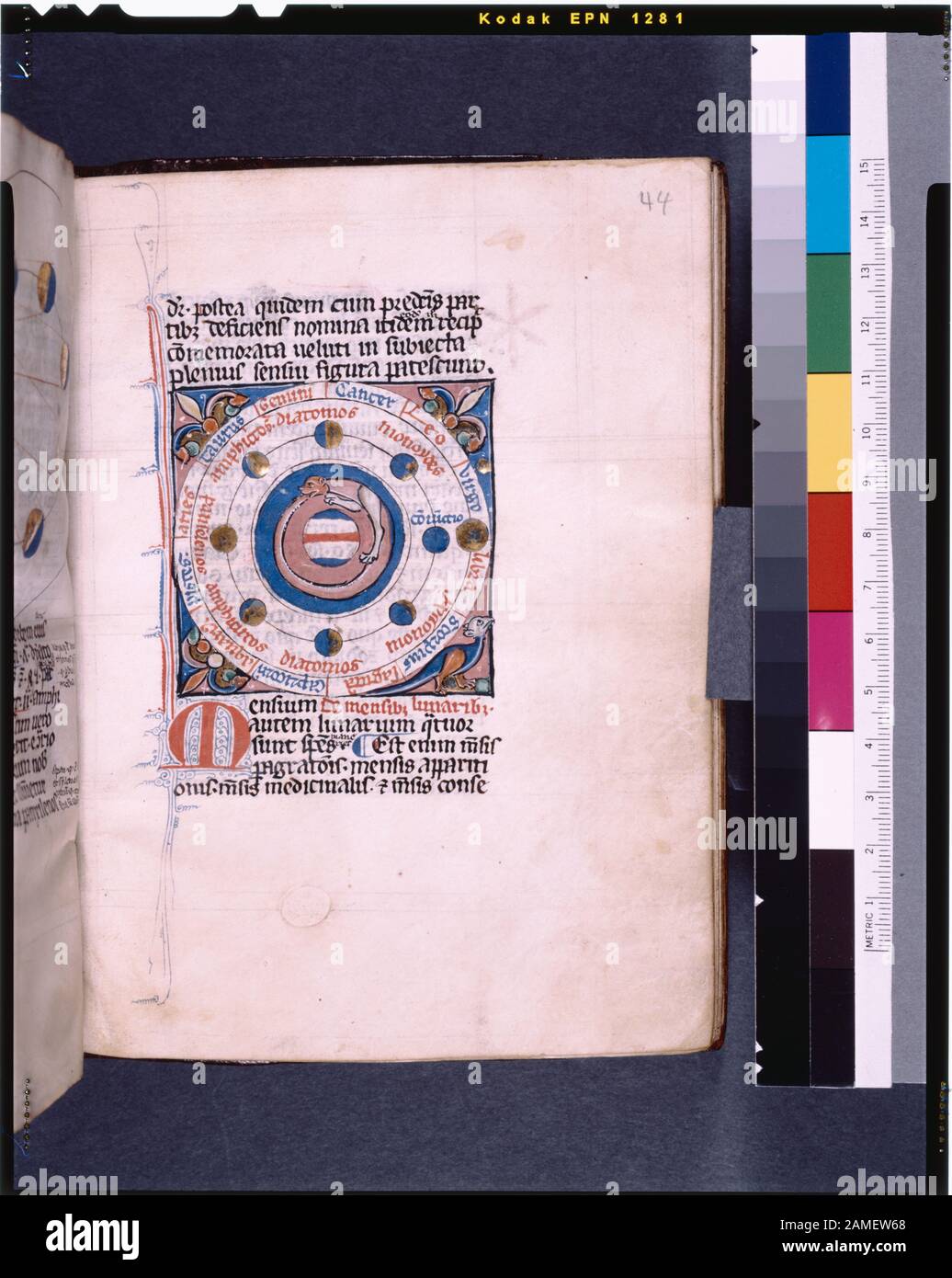 The earth in the center, surrounded by a tail-biting dog, the moon and its phases, the sun on its orbit, correlated to signs of the zodiac  Listed in De Ricci, Seymour, Census of Medieval and Renaissance Manuscripts in the United States and Canada. New York. N.Y.: H.W. Wilson, 1935; and Supplement, New York, N.Y.: Bibliographical Society of America, 1962. Ownership : Sold July 1886 by Ellis and Scrutton to Charles H. Kalbfleisch.  Given by Alexander Maitland. 2 (possibly more), with second on f. 141v & pastedown Calendar colored in green, red and blue.  Red and blue initials with opposing colo Stock Photo